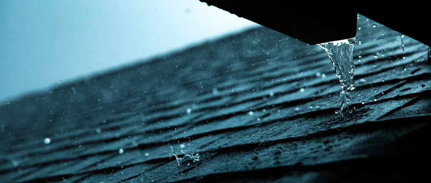 image of hail falling on an asphalt roof