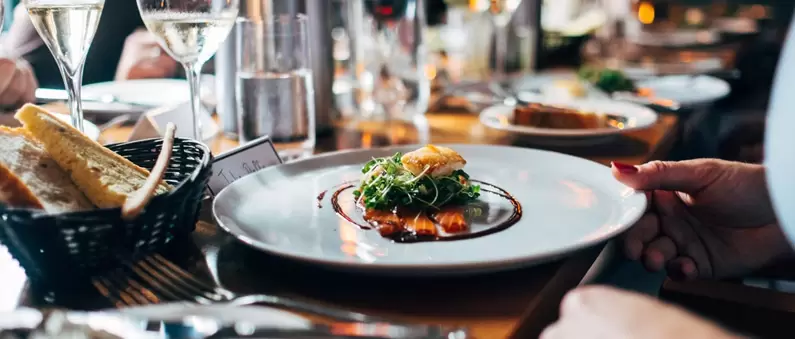 An artistically presented entrée is served at a restaurant table in Northern Colorado