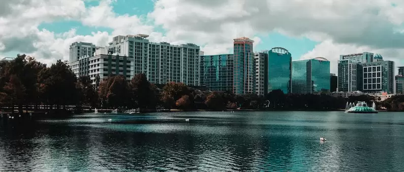 A view of the Orlando skyline as seen across a lake from West Orlando