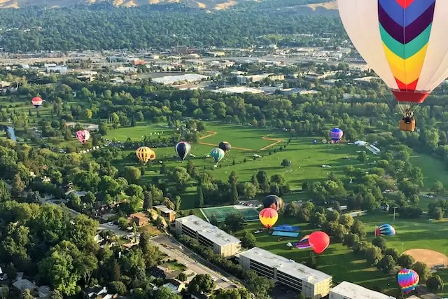 image of hot air balloons landing above Boise Idaho