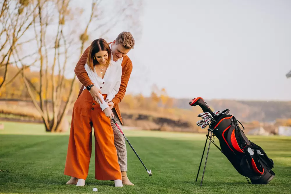 image of couple playing golf together at Pine Creek Golf Center