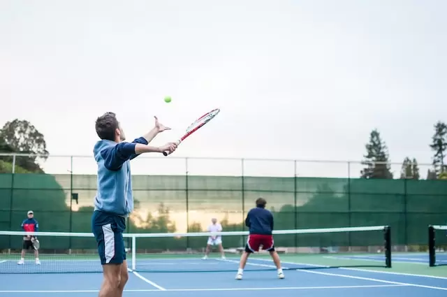 image of friends playing a tennis match at the Missouri City Recreation and Tennis Center