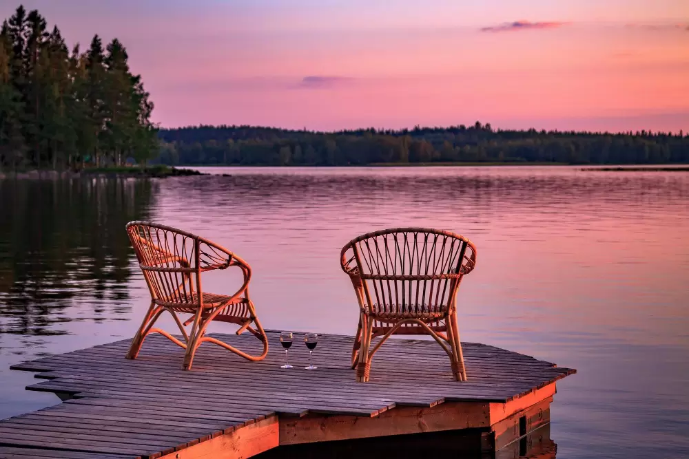 two wooden chairs at the Bowles Lake deck